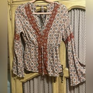 Bell sleeves, long sleeved blouse